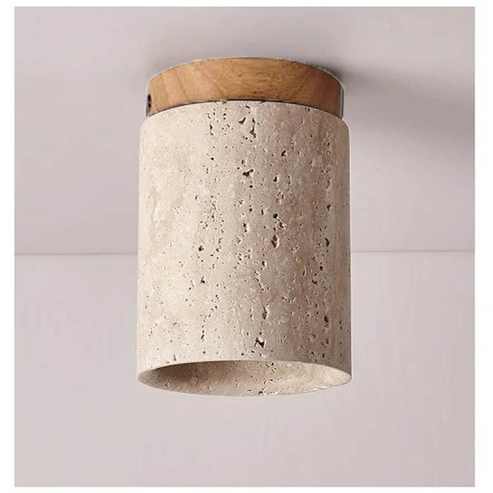 Close-up of natural travertine texture and oak wood on modern Scandinavian ceiling light fitting