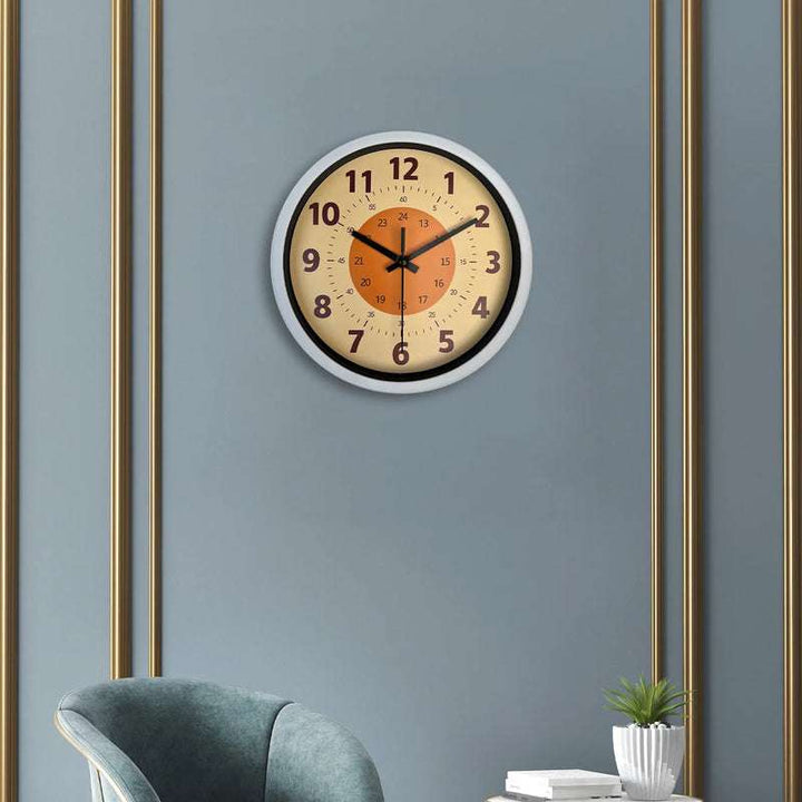 Nordic style wall clock with black frame mounted on elegant grey wall