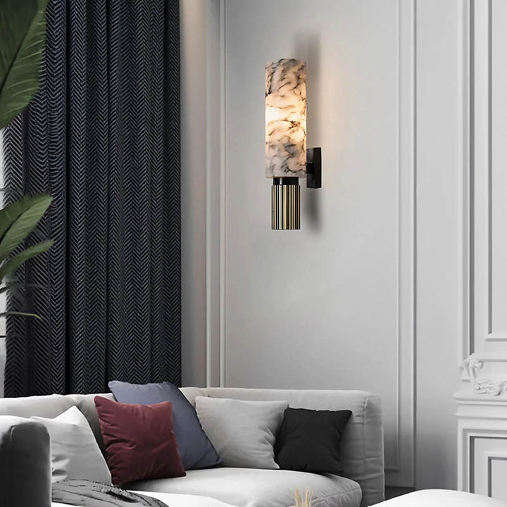 Vintage marble and brass wall lamp above sofa in luxury lounge, perfect for warm ambient living room lighting.