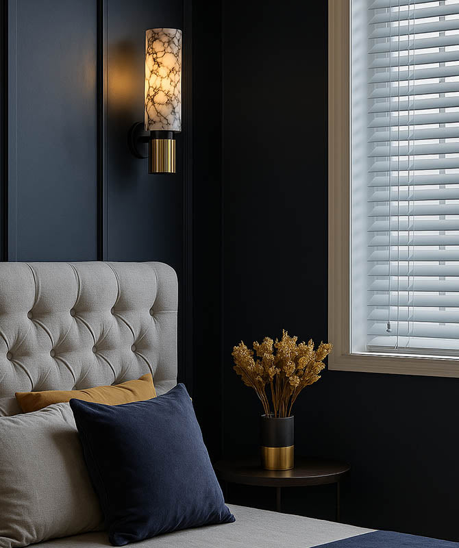 Warm LED marble wall sconce with brass base in cosy living room, perfect for modern or minimalist UK home styling.
