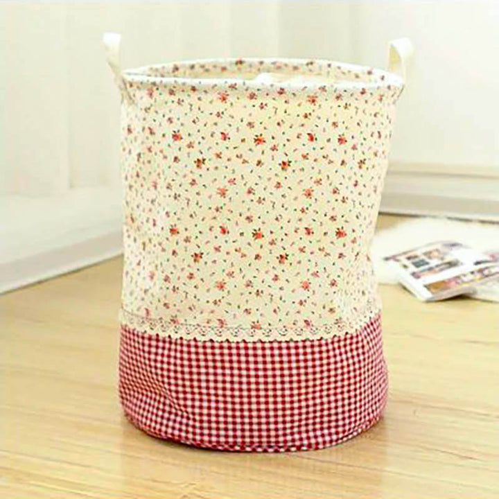 Floral cotton storage basket with drawstring top and handles, perfect for laundry, toys, or closet storage, Nordic Essentials.