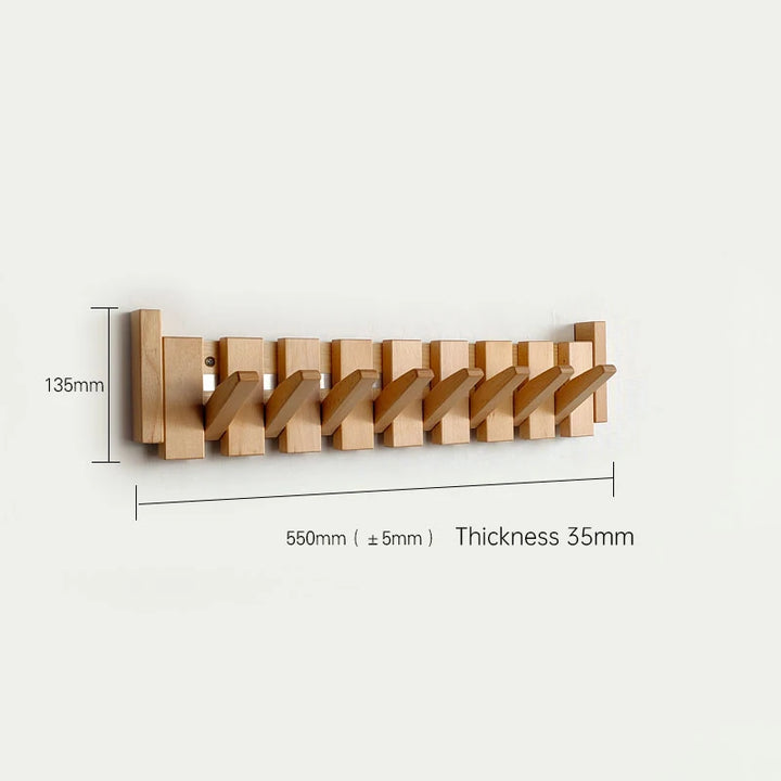 Wooden wall-mounted coat rack with dimensions on a white background