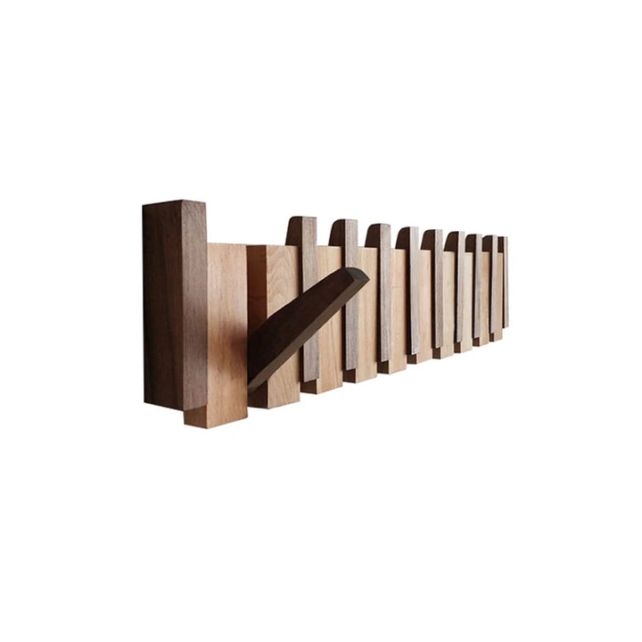 Wooden wall hook with multiple hooks on a white background