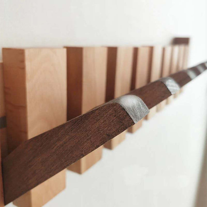 Wooden sword with a silver hilt on a white background
