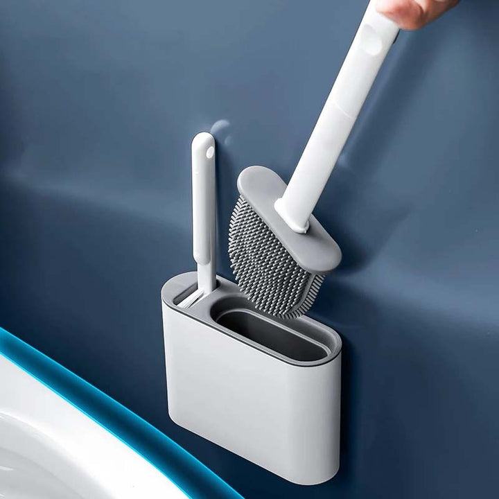 Gray and white cleaning brush set with holder against a blue background