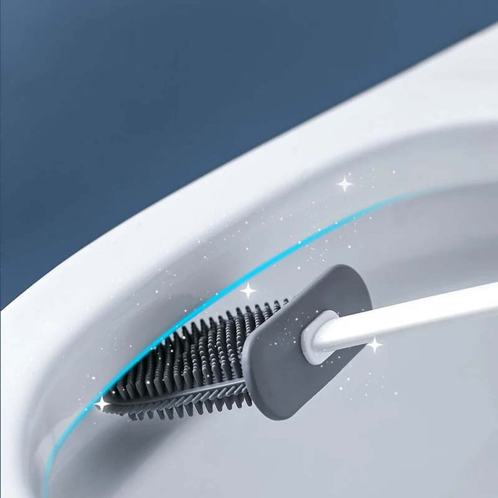 Cleaning brush with bristles against a white surface