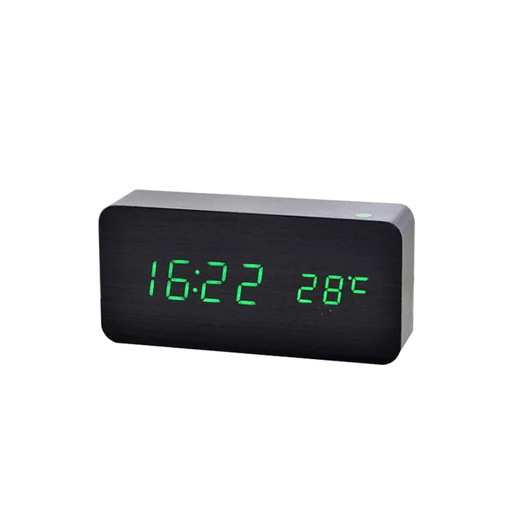 Black wooden alarm clock with green LED display showing time and temperature