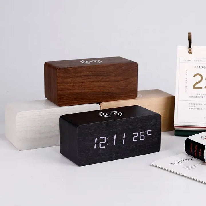 Minimalist wooden alarm clocks in black, white, walnut, and bamboo finishes