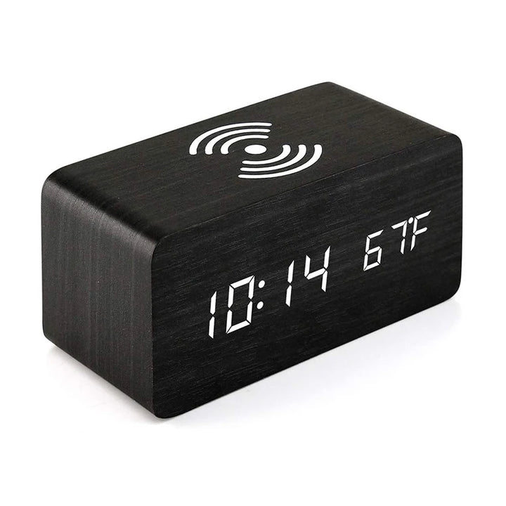 Black minimalist wooden alarm clock with white LED display and wireless charging