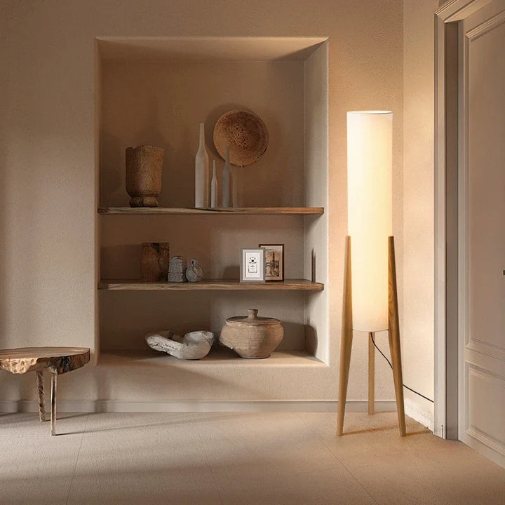 Front view of the HOJ Japanese tall floor lamp, with warm white fabric diffuser and tripod wood base