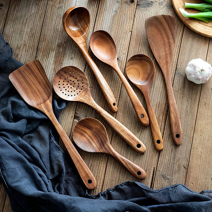 Wooden Kitchen Utensil Set pieces on the wooden table