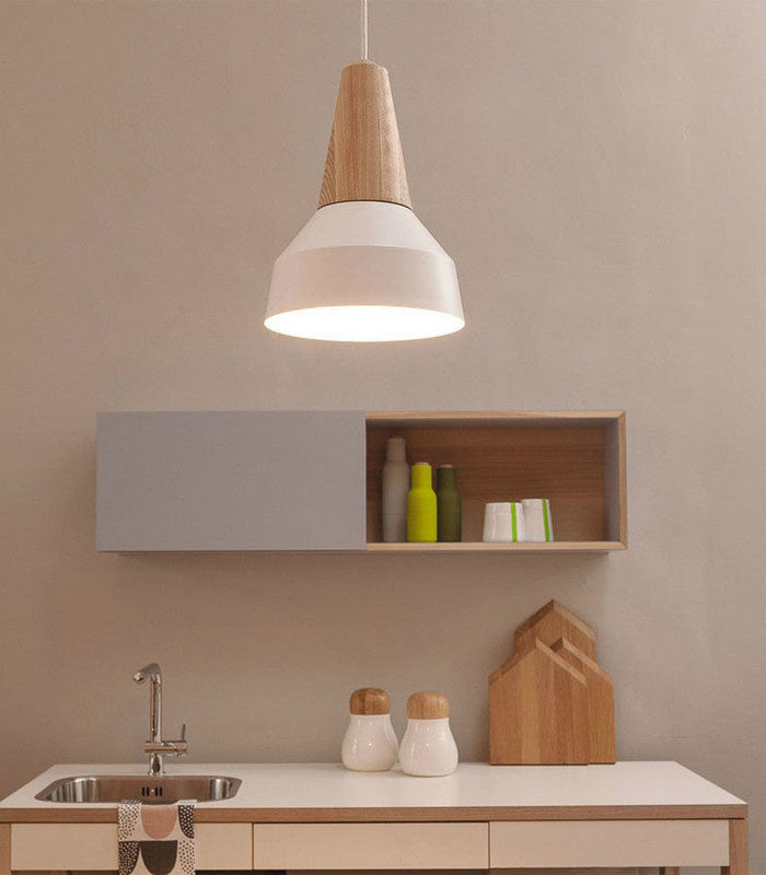 Modern kitchen with pendant light, shelf, and countertop.
