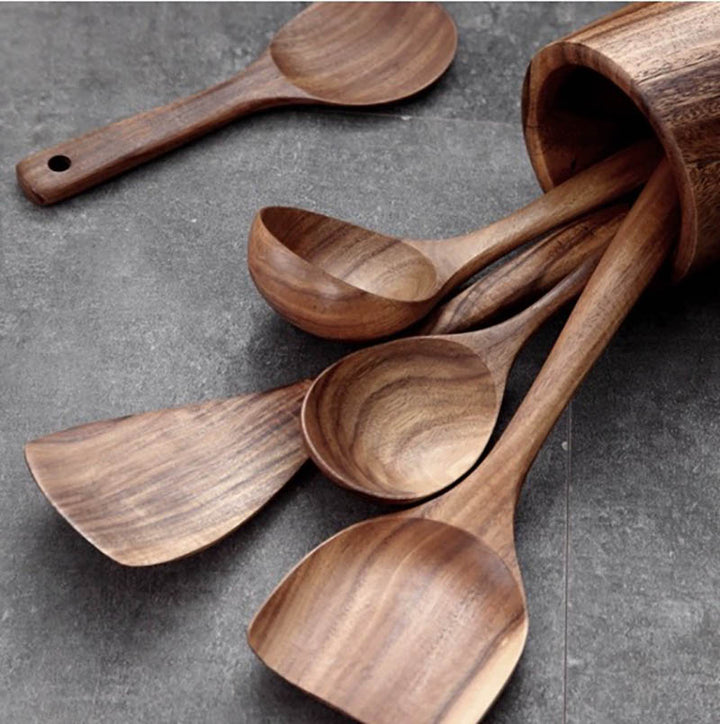 Set of wooden spoons on a gray surface