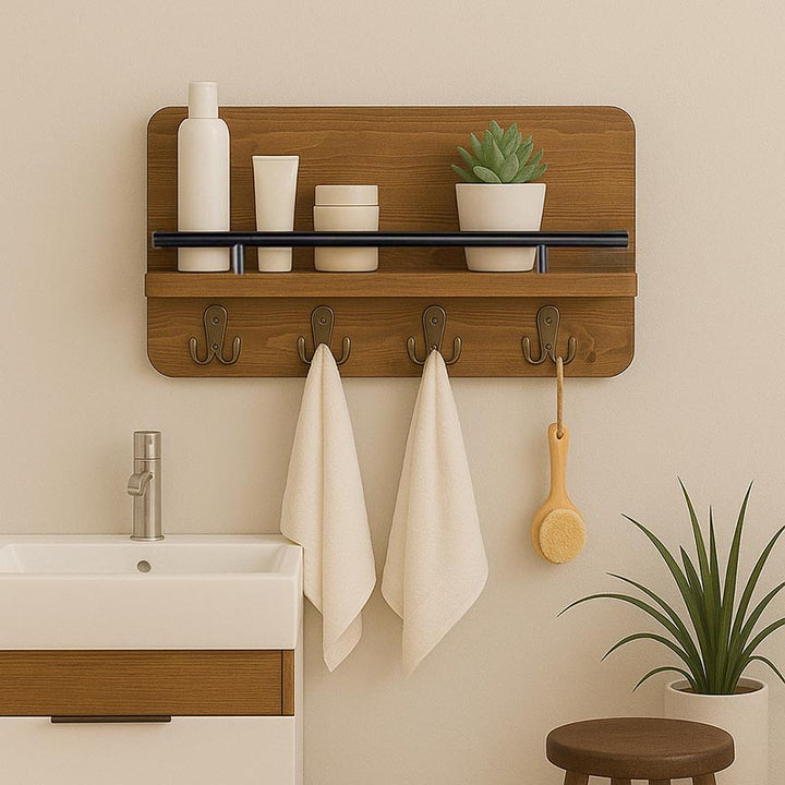 Scandinavian-style wooden shelf with black metal rail and towel hooks, used for bathroom toiletries and hand towels.