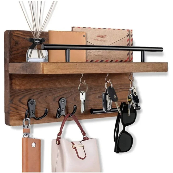 Entryway key holder in dark wood with shelf, mounted near door to store keys, sunglasses, and small daily items.