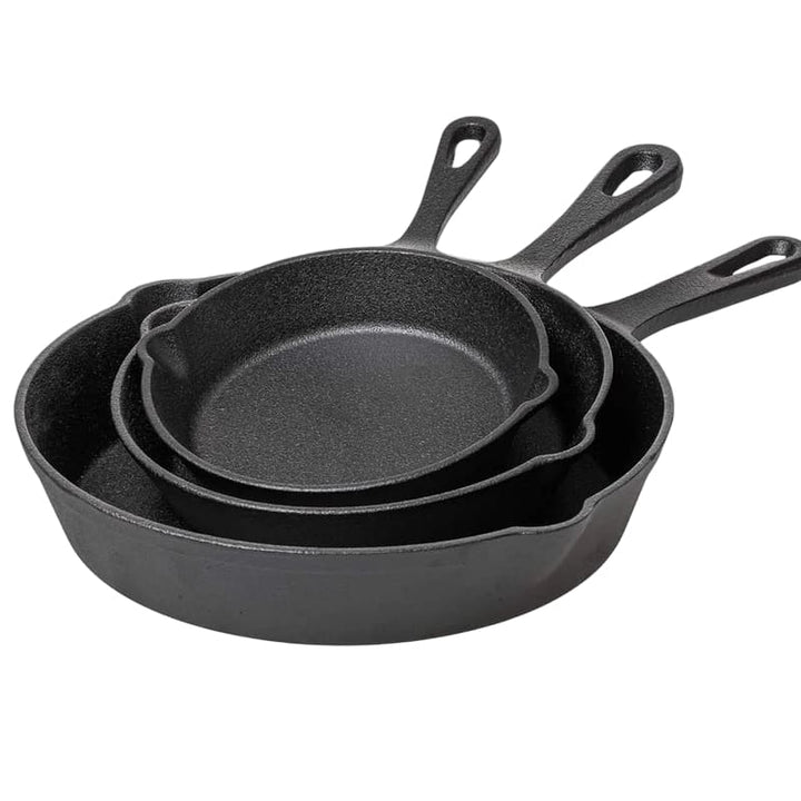 Set of three cast iron skillets stacked together, showing durable construction for versatile cooking.