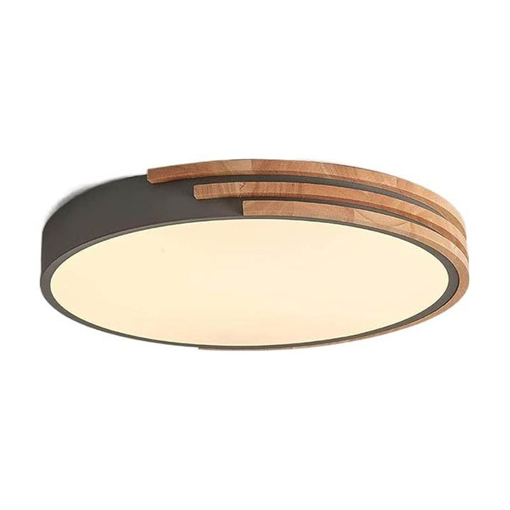 Round Scandinavian LED ceiling light in wood and acrylic with soft warm glow, minimalist design