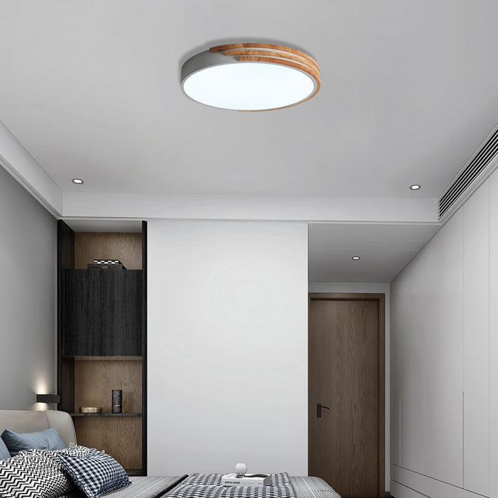 white and wood flush mount ceiling light in minimalist bedroom, soft white illumination