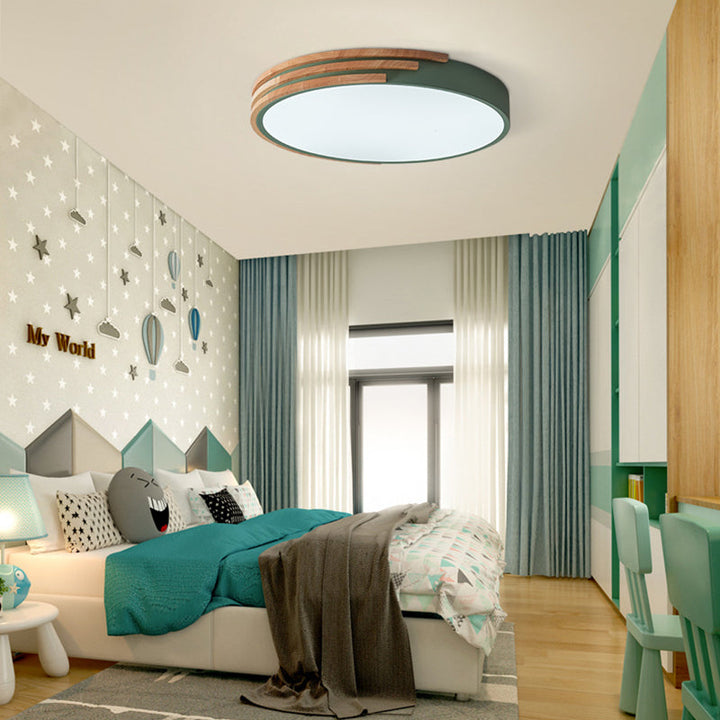Green Scandinavian ceiling light in children’s bedroom, modern LED design with wood accent
