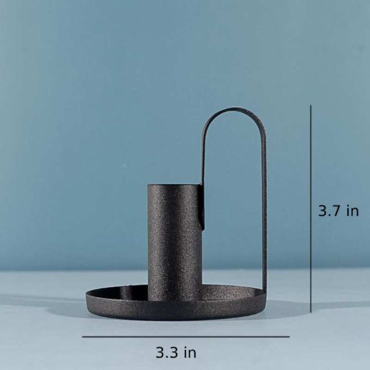 Candle holder measuring 3.7 in (9.4 cm) high and 3.3 in (8.4 cm) wide, minimalist black iron design