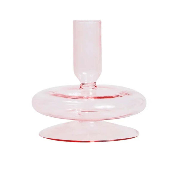 Translucent light pink glass candle holder with single ring base and slim cylindrical top