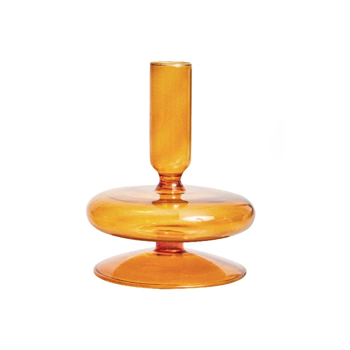 Single amber glass taper candle holder with round base and minimalist Scandinavian design
