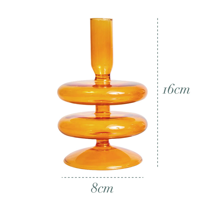 Orange glass candle holder measuring 6.3 in (16 cm) tall and 3.1 in (8 cm) wide with double-ring base in Scandinavian design