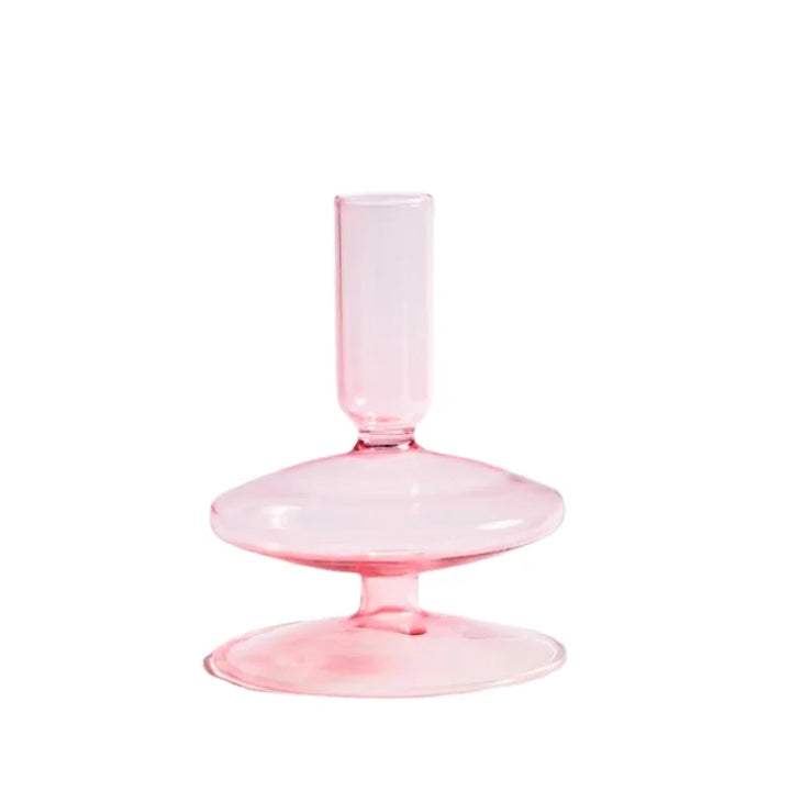 Soft pink glass taper candle holder with rounded base and minimalist Scandinavian design