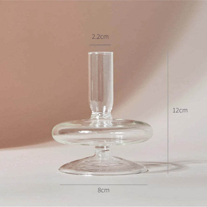 Clear glass candle holder measuring 4.7 in (12 cm) tall and 3.1 in (8 cm) wide with 0.9 in (2.2 cm) opening