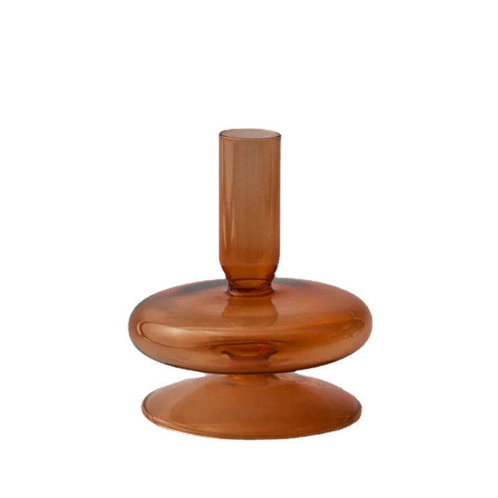 Amber brown glass candle holder with single rounded base and sleek cylindrical neck