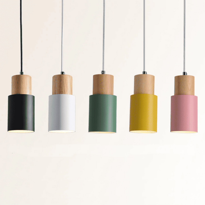 Set of five Nordic pendant lights in black, white, green, yellow, and pink with natural wood tops, showcasing Scandinavian design.