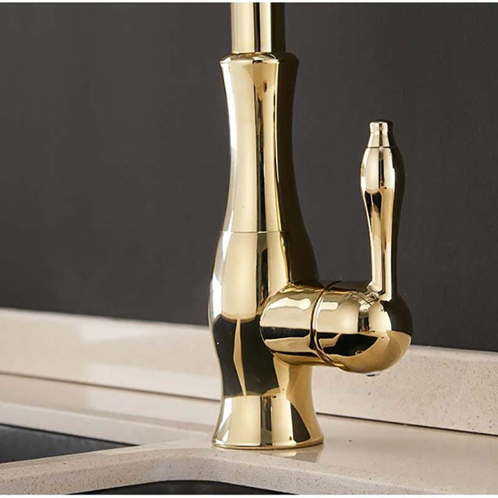 Gold faucet on a dark background