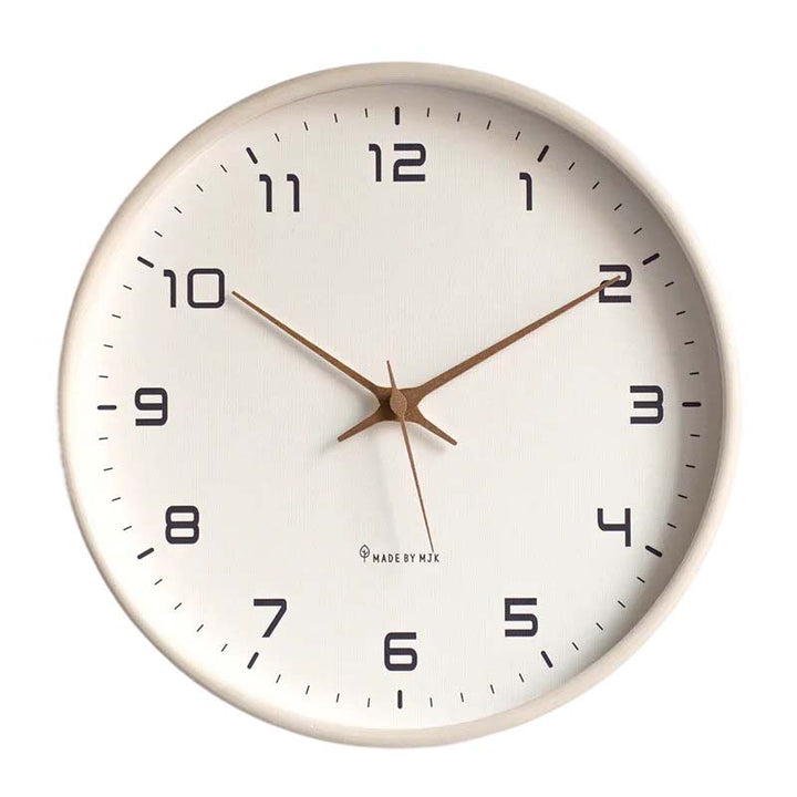Round kitchen wall clock with beige frame and white face on a white background