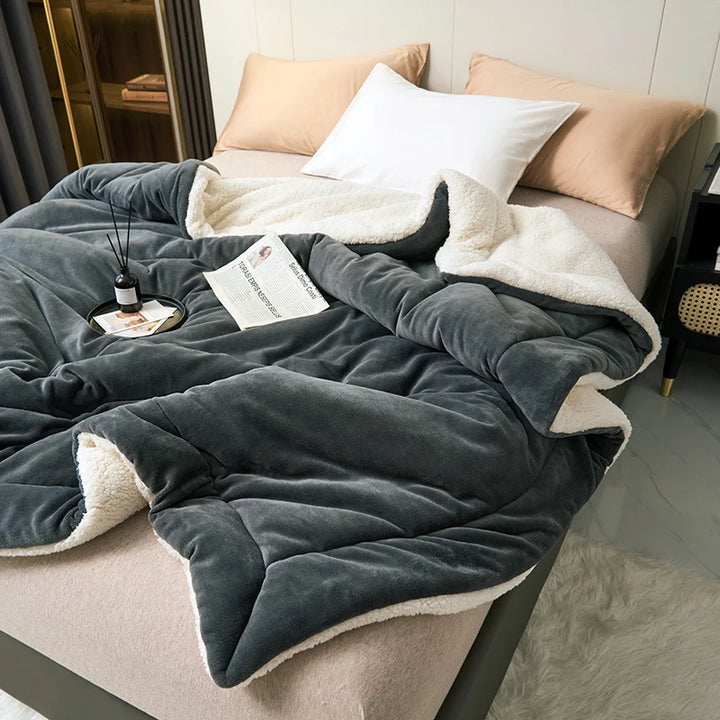 Charcoal milk fleece blanket with cream lambswool trim, warm Scandinavian bedding for modern home décor