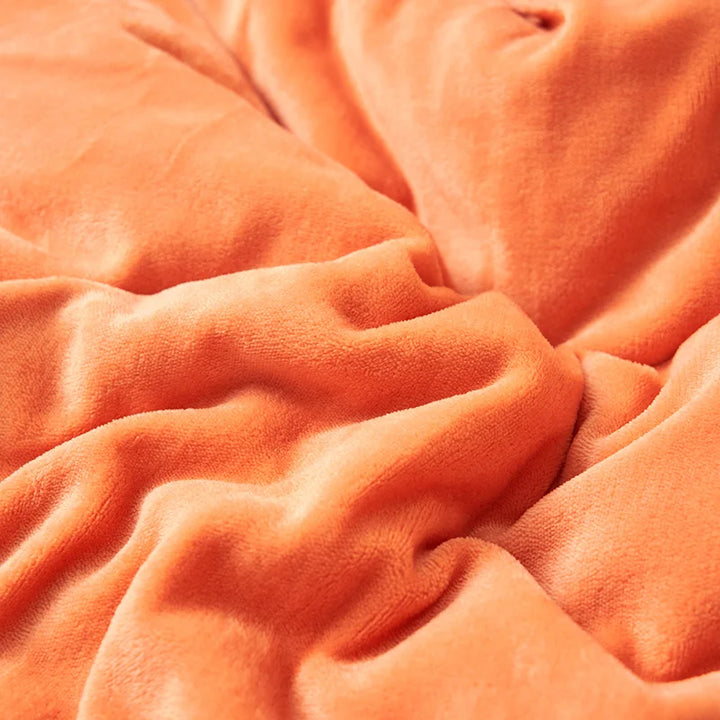 Close-up of orange fleece texture, ultra-soft milk fleece fabric for luxurious Scandinavian blanket design