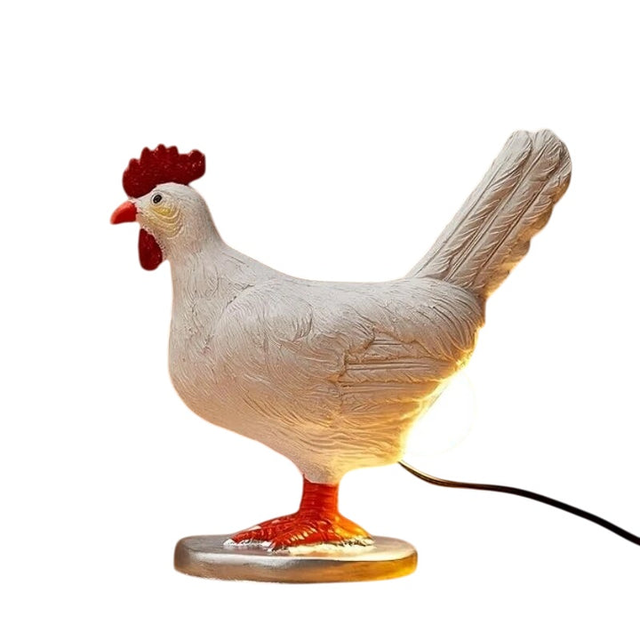 Whimsical chicken lamp on plain background highlighting sculpted design and glowing light