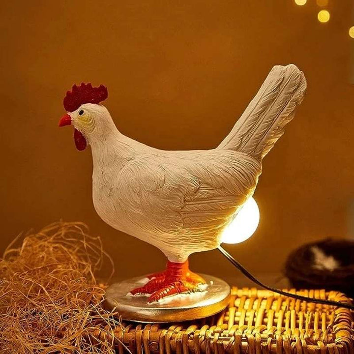 Whimsical chicken table lamp on wicker surface under warm ambient light creating a cosy atmosphere