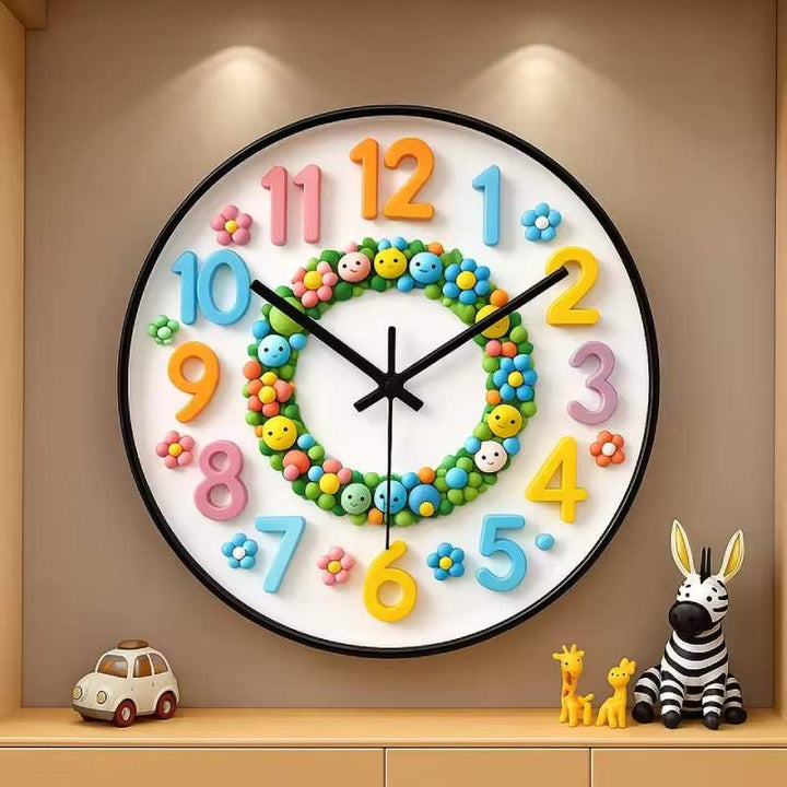 Large cartoon wall clock with multicoloured numbers displayed on a shelf with children’s toys.