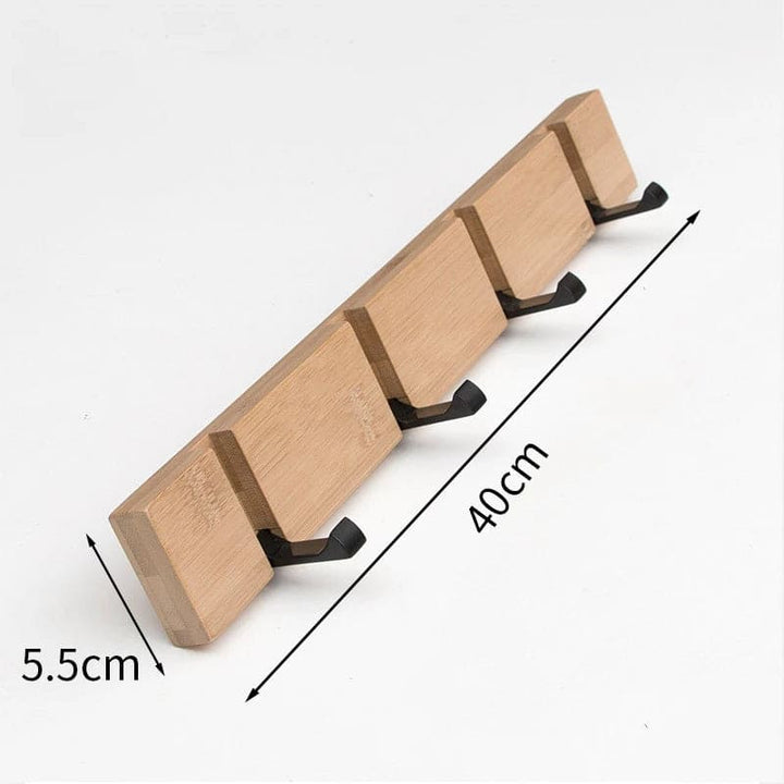 Bamboo wall hook rack measuring 40 cm (15.7 in) wide and 5.5 cm (2.2 in) deep with flip-down hooks.