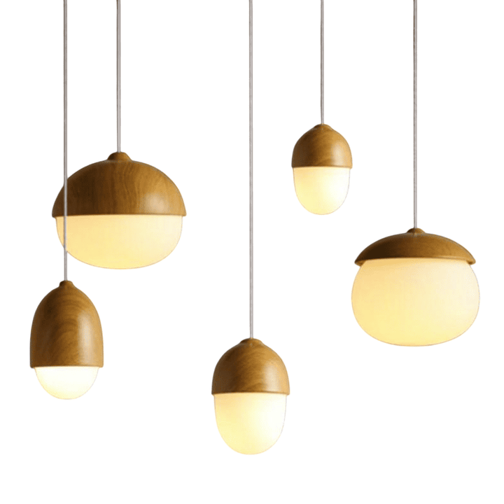 Set of five Nordic pendant lights with faux wood tops and frosted glass globes, adjustable hanging cords.