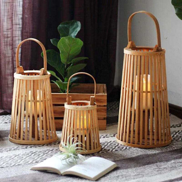 Set of natural bamboo candle lanterns creating warm ambient light in Nordic living room