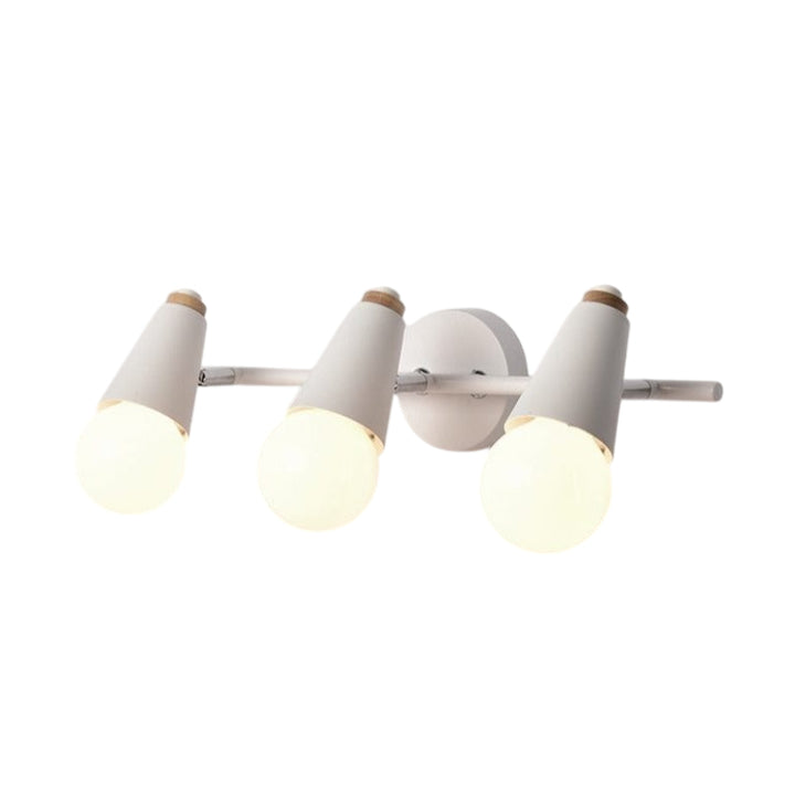 Three-light white wall sconce in Scandinavian minimalist design, featuring cone shades and soft warm illumination.