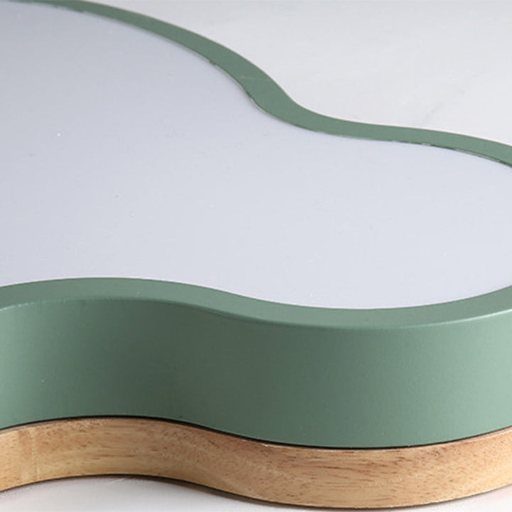 Close-up view of green metal and wooden frame detailing on the Nordic cloud ceiling lamp.