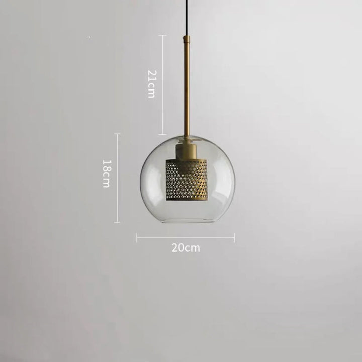 Clear glass pendant light with perforated metal shade measuring 21 cm high and 20 cm wide