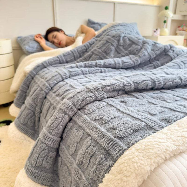 Blue faux lambswool fleece blanket on bed, plush Nordic-style throw for winter comfort and warmth