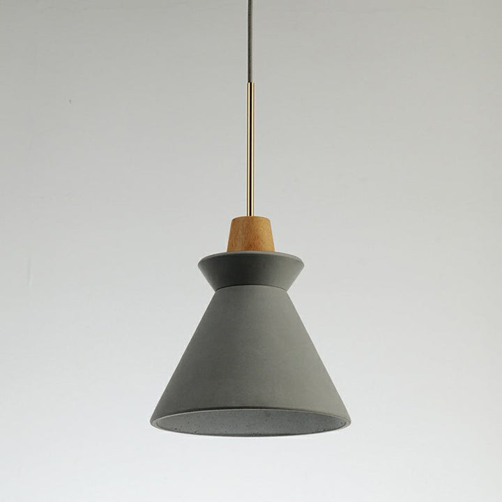 Nordic Wood & Cement Pendant Light hanging above dining table, minimalist Scandinavian interior lighting design.