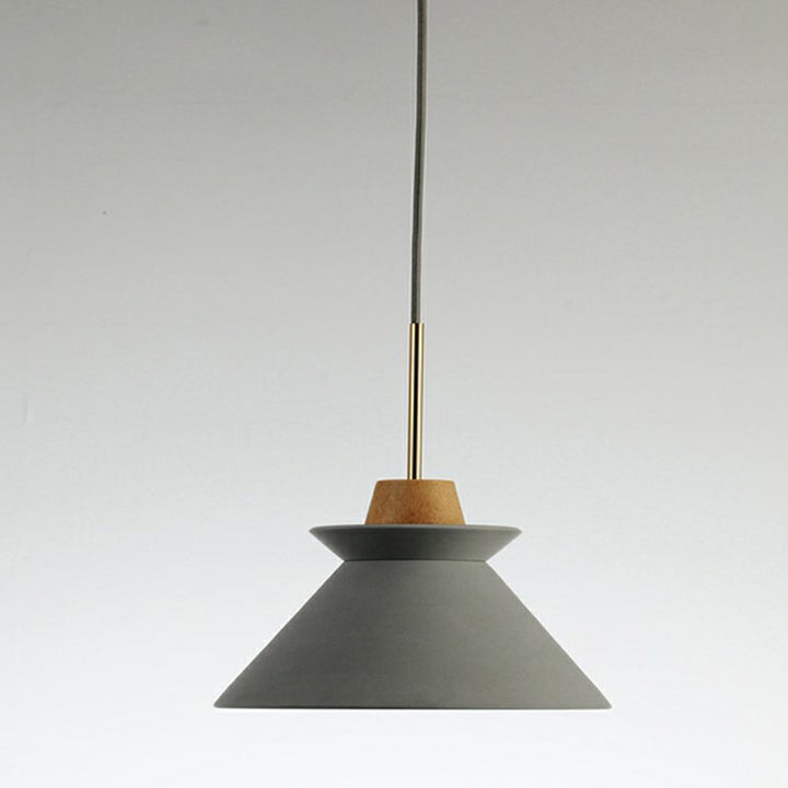 Grey cement pendant lamp with natural wood top and brass rod, Scandinavian-style modern interior lighting.