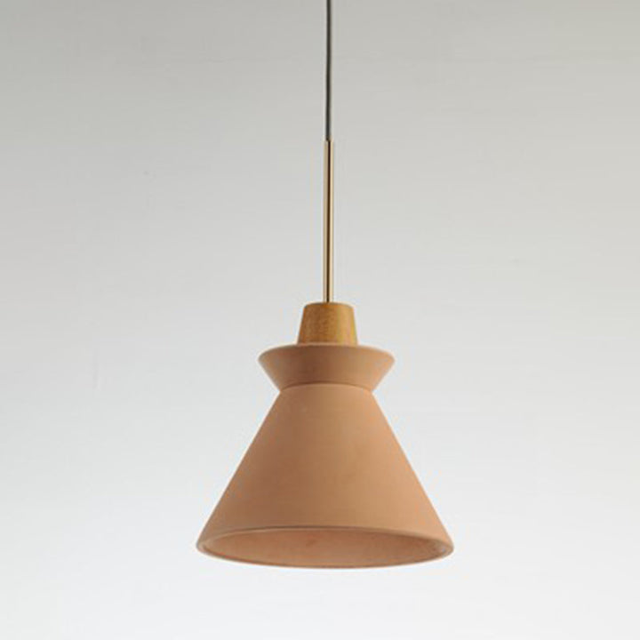 Pink cement and wood pendant light in minimalist Scandinavian kitchen lighting setup.