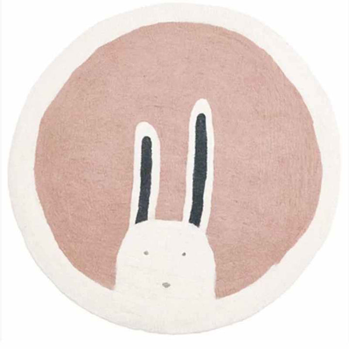 Round pink and white rug with bunny design, ultra-soft faux cashmere texture for kids’ playroom or nursery.