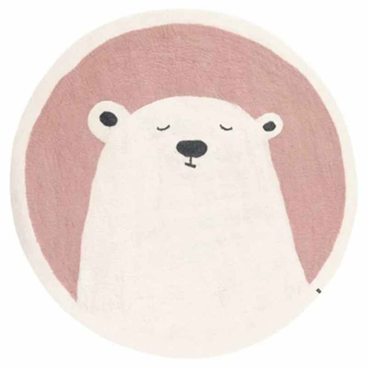 Round blush rug with polar bear design, soft faux cashmere texture ideal for kids’ room or nursery.